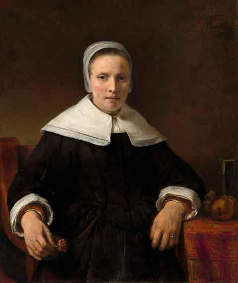 Rembrandt van Rijn — A Woman Holding a Pink