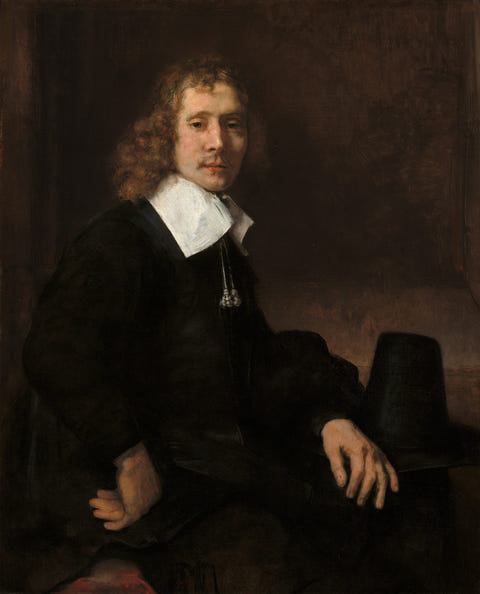 Rembrandt van Rijn — A Young Man Seated at a Table (possibly Govaert Flinck)